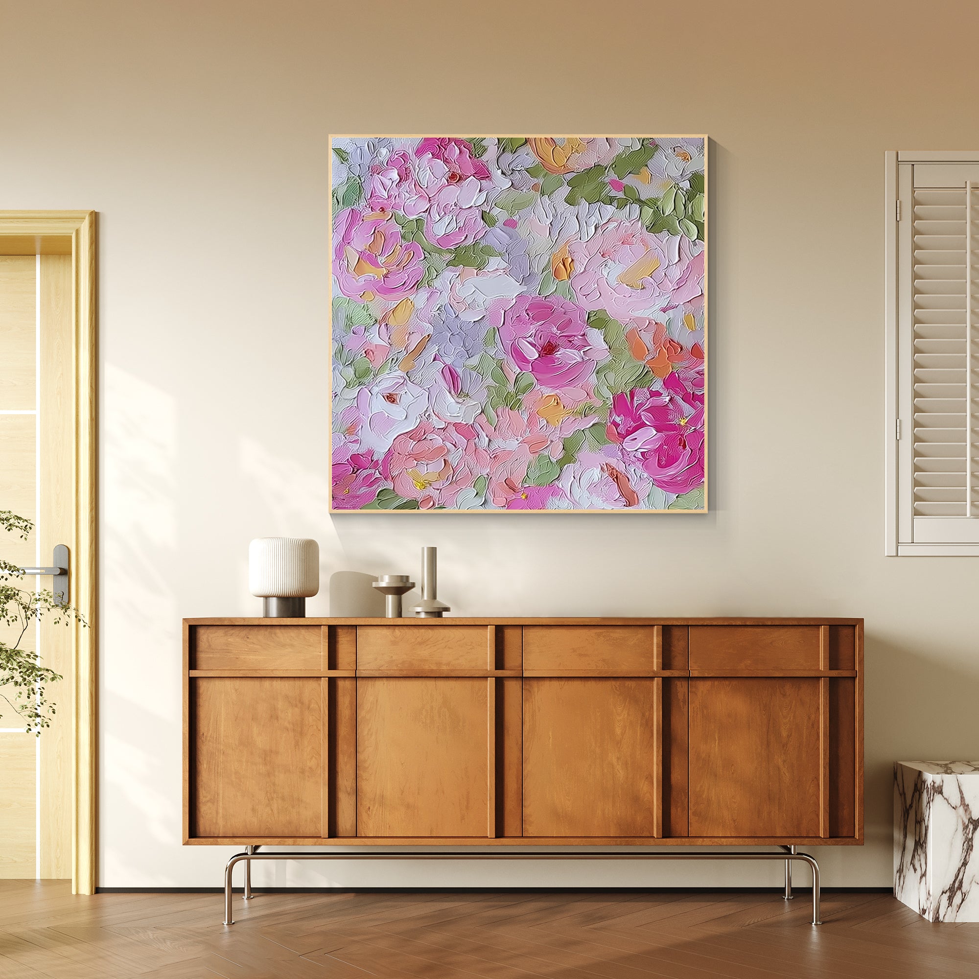 Pink floral wall art displayed above a beige sofa in a bright modern living room.
